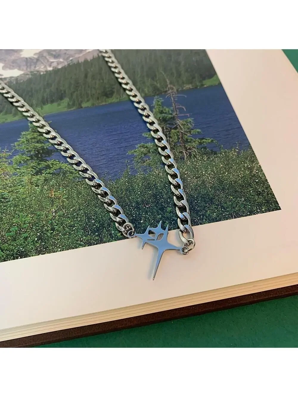 Y2k 2000s cyber grunge style cuban link star pendant stainless steel necklace.